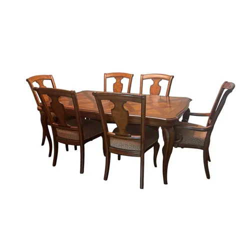 A seven-piece burl parquetry dining set with six chairs