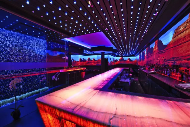 Warm-lit interior of Haven Restaurant and Gastro Lounge in Miami Beach, designed by Maria Cooper